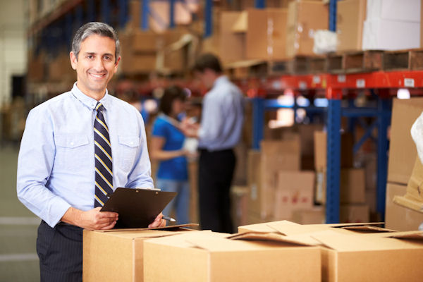 supervisor evaluating working conditions in a warehouse.