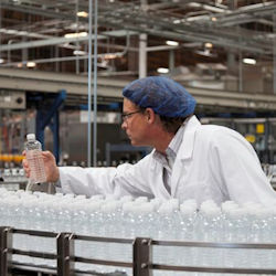 worker bending while working at an assembly line