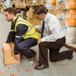 worker being trained how to lift heavy objects