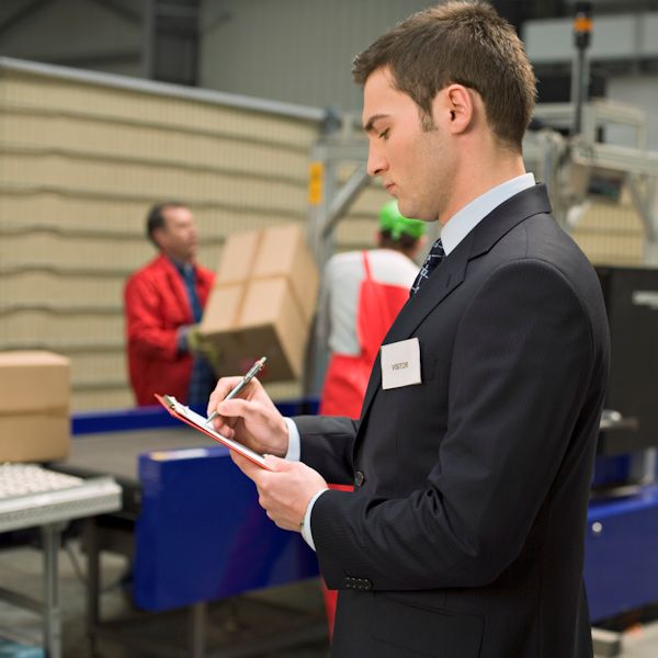 Image showing an employee making notes on an observation