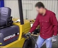 worker is refueling a diesel forklift