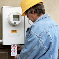 Image of employee inspecting lockout tagout device 