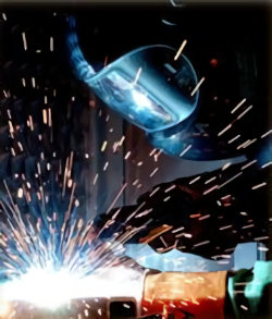 Image of a welder in full PPE doing hot work.