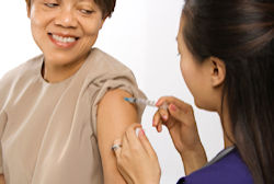 Patient receiving vaccination from nurse