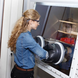 Employee working at glove box station