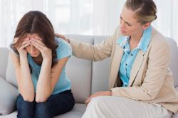 Image of mental health care provider helping an employee.