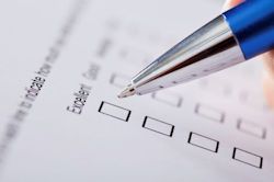 Image of employee filling out a survey.