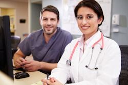 Image of two happy healthcare workers.