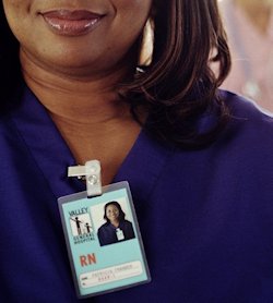 Image of employee with identificlation badge.