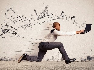 Staged image of an employee chasing a computer