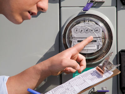 Image of an employee checking meter readings