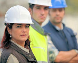 Three workers outdoors facing forward.