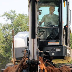 Worker in backhoe