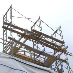 Workers on crossbraced scaffold