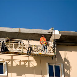 Worker on suspended scaffold