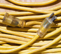 Long yellow Extention cord rolled up