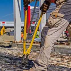 Image of man using bolt cutters