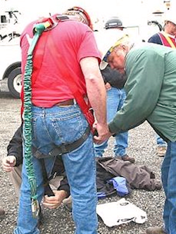 Supervisor giving hands-on fall protection equipment show and tell