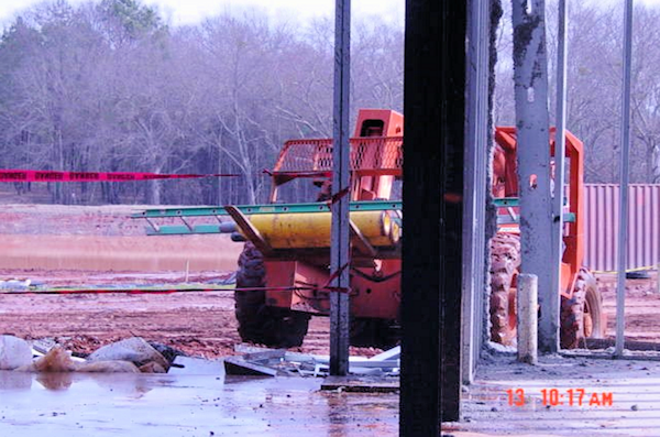 gas cylinders being transported on construction equipment