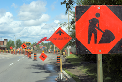 Traffic zone is blocked off with warning signs.