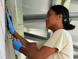 worker using gloves to work