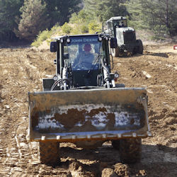 heavy equipment with enclosed cab provided hearing protection