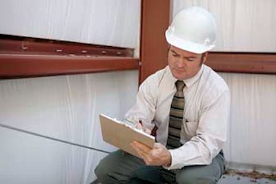 Engineer reviewing formal written survey report