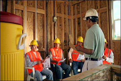 Training session with trainer up front and employees seated