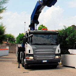 Articulating crane delivering materials