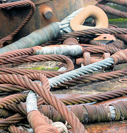 Old taped and rusted crane cables need inspection