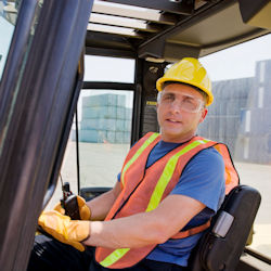 Operator sitting in crane cab