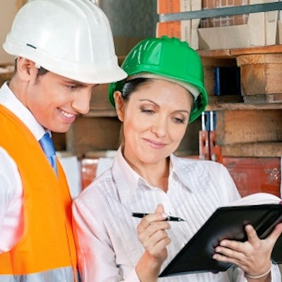 Two employees who appear pleased while reviewing Monitored Performance