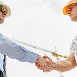 Manager recognizing worker by shaking hands