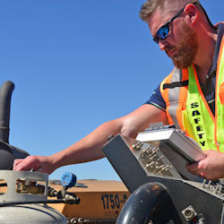 Worker adjusting propane tank