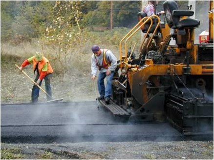 Road workers in extremely hot conditions