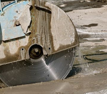 Image of using a saw while wet cutting.