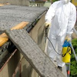 Worker using wet meethod to reduce dust exposure