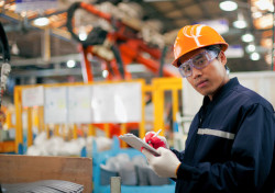 Worker standing amidst work site