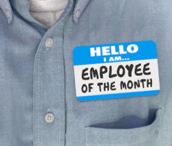 employee wearing a employee of the  month name tag