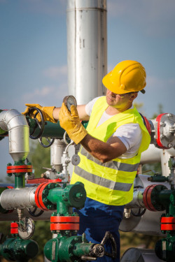 Worker wearing hard hat and gloves as protective PPE