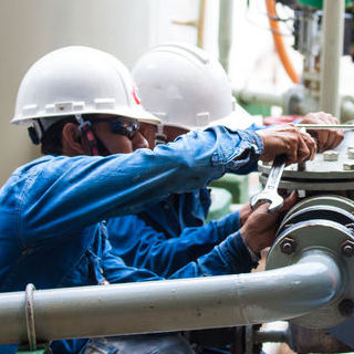 On the job training being performed with two employees