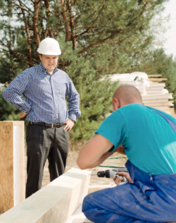 Supervisor overseeing outside worker