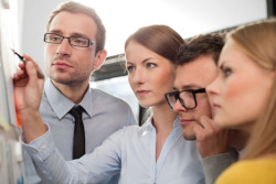 Group of four deciding what safety training is necessary