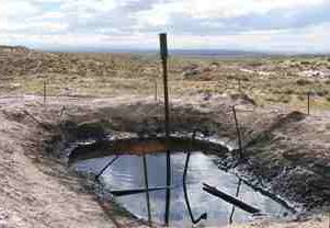 Picture of a flare pit used for temporary storage of liquid hydrocarbons