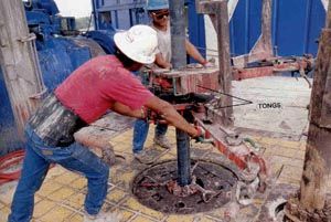 worker close to dangerous rotating parts of equipment