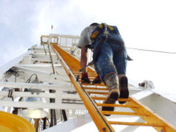 derrickhand climbs up the derrick to the monkeyboard