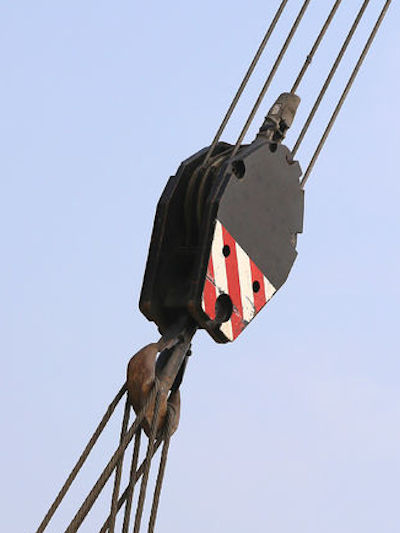 Large pulley with sheave used to route cables.