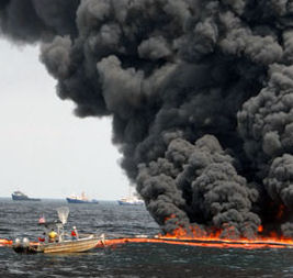 Enormous black smoke fire from a rig