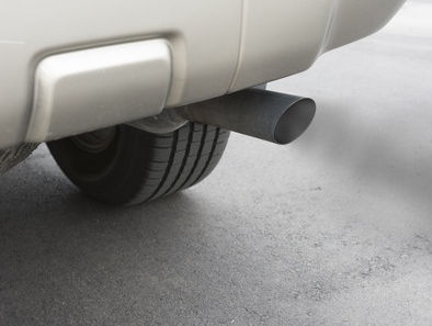 Exhaust pipe of car spewing dangerous carbon monoxide