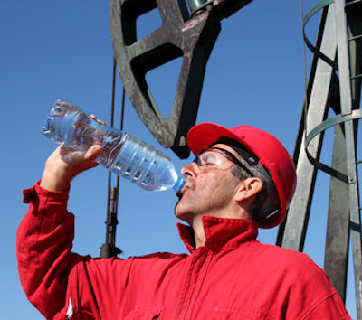 Working outside this worker is drinking adequate water